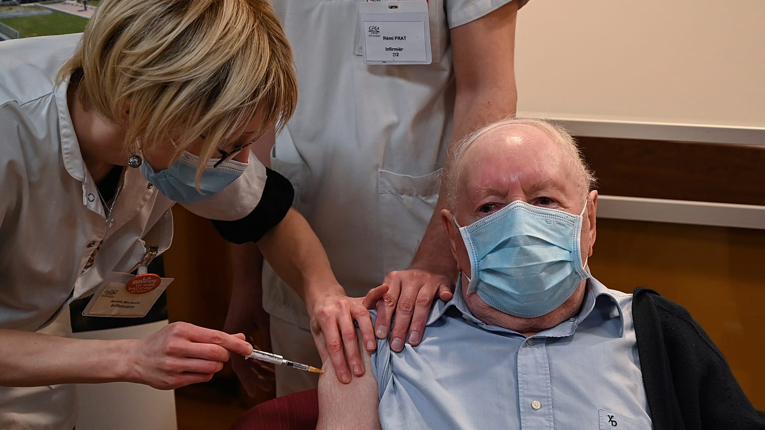 Alain a French 92-year-old man receives a dose of the Pfizer-BioNTech Covid-19 vaccine.
