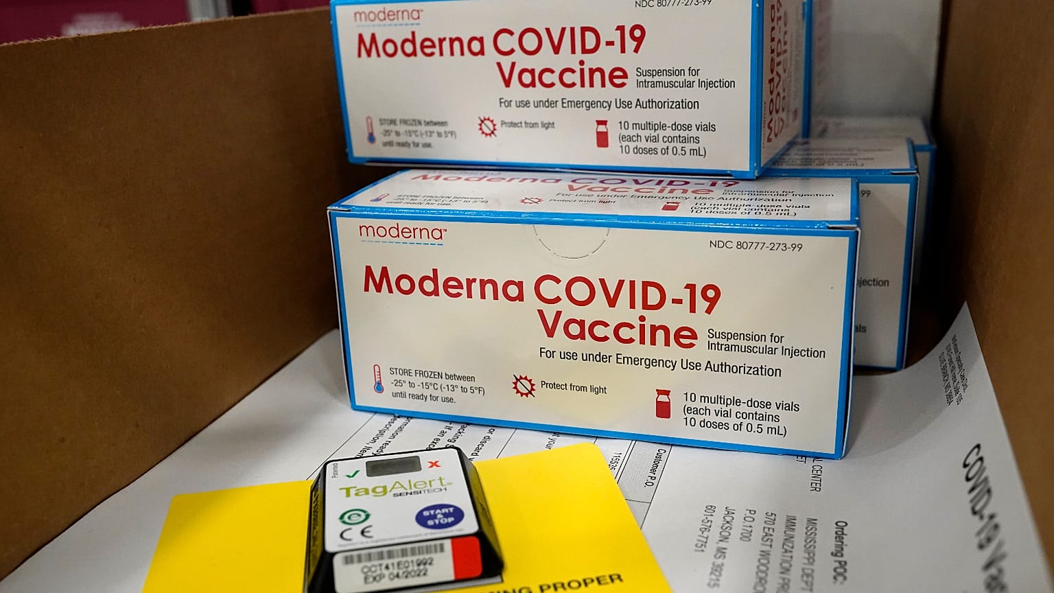 Boxes containing the Moderna COVID-19 vaccine are prepared to be shipped at the McKesson distribution center in Olive Branch, Miss., Sunday, Dec. 20, 2020.