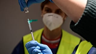 A health worker prepares a Pfizer coronavirus vaccine
