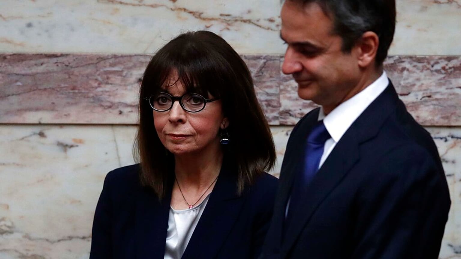 Greek President Katerina Sakellaropoulou, left, and Greece's Prime Minister Kyriakos Mitsotakis 