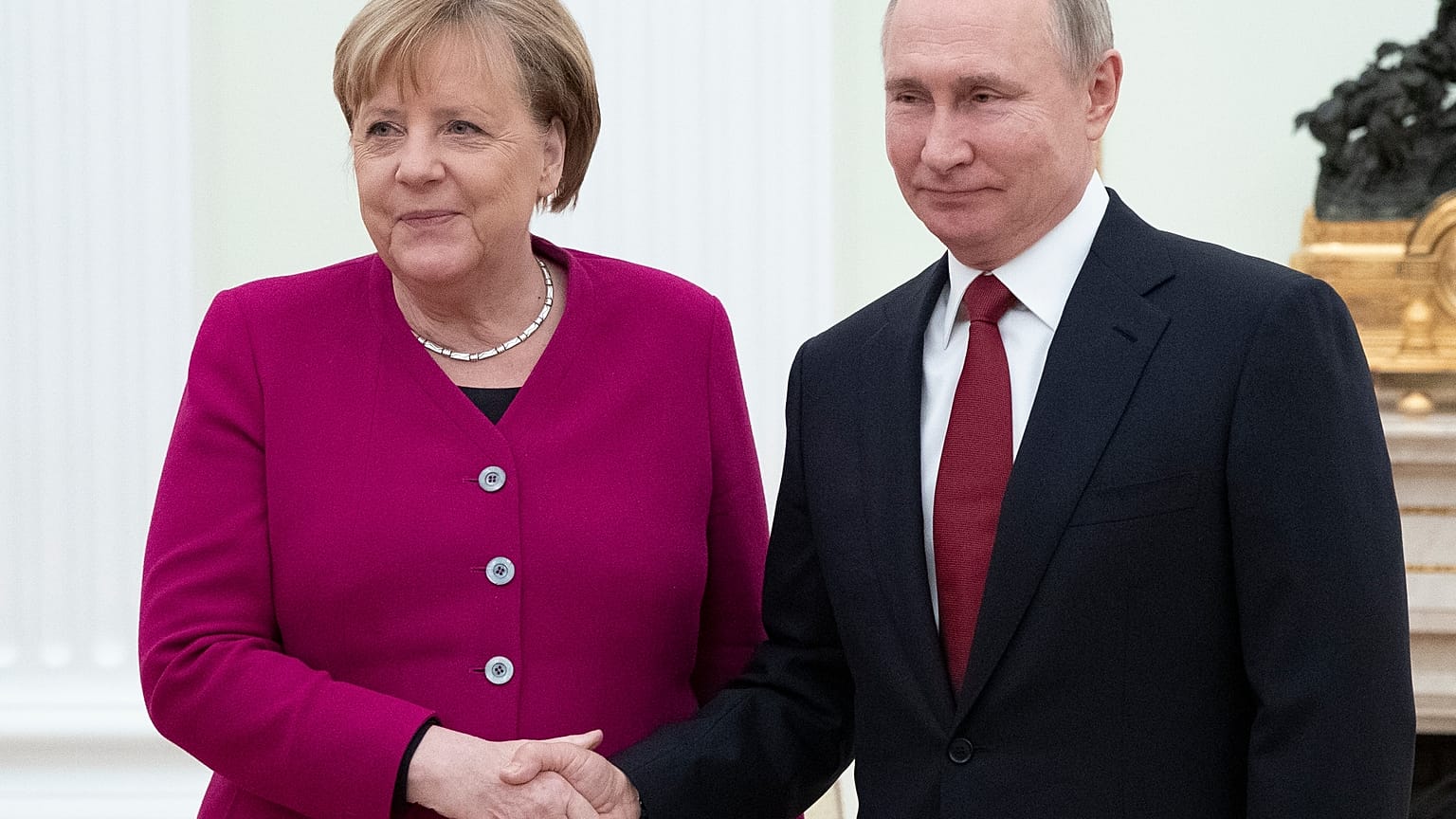 Russian President Vladimir Putin, right, and German Chancellor Angela Merkel pose for a photo prior to the talks in the Kremlin in Moscow, Russia, Jan. 11, 2020.