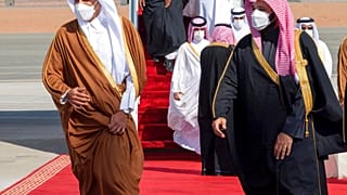 Saudi Arabia's Crown Prince Mohammed bin Salman, right, welcomes Qatar's Emir Sheikh Tamim bin Hamad al-Thani upon his arrival to attend the Gulf Cooperation Council's summit.