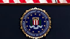 The FBI seal is seen before a news conference at FBI headquarters in Washington