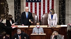 Speaker of the House Nancy Pelosi, D-Calif., and Vice President Mike Pence officiate as a joint session of the House and Senate on January 6, 2021.