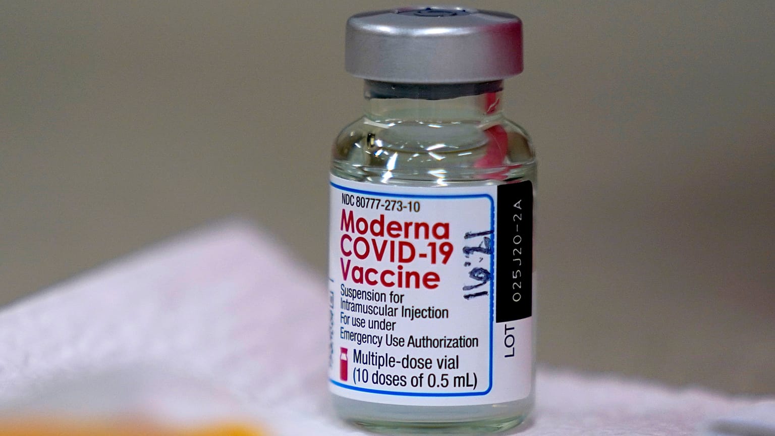 In this file photo from Wednesday, Dec. 30, 2020, a bottle of Moderna COVID-19 vaccine is placed on a table before being utilised in Topeka, USA. 