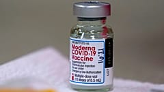 In this file photo from Wednesday, Dec. 30, 2020, a bottle of Moderna COVID-19 vaccine is placed on a table before being utilised in Topeka, USA. 