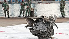 Investigators of Indonesian National Transportation Safety Committee inspect parts of Sriwijaya Air SJ-182 recovered from the Java Sea where it crashed on Saturday 9 Jan. 2021