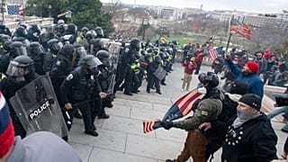 U.S. Capitol Police push back demonstrators who were trying to enter the U.S. Capitol on Wednesday, Jan. 6, 2021, in Washington.