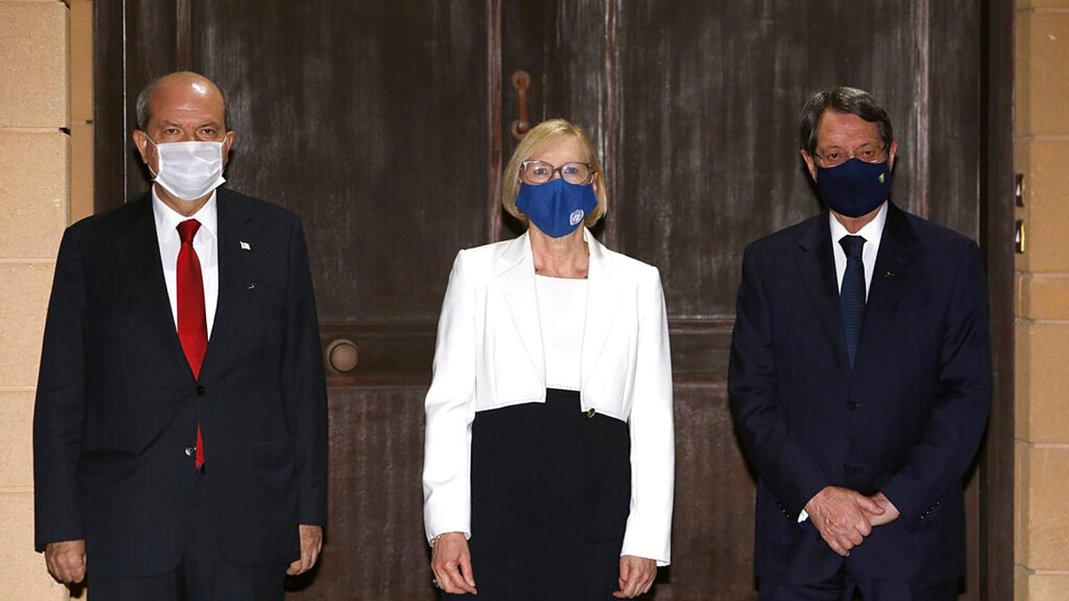 Turkish Cypriot leader Ersin Tatar, left, Elizabeth Spehar, center, head of the United Nations Peace Keeping Force in Cyprus and Nicos Anastasiades, the Greek Cypriot Presiden