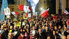 People stage a protest in Valletta, Malta, Sunday, Dec. 1, 2019.