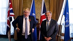 Britain's Foreign Secretary Boris Johnson, left, poses for a photograph with UN Secretary General Antonio Guterres