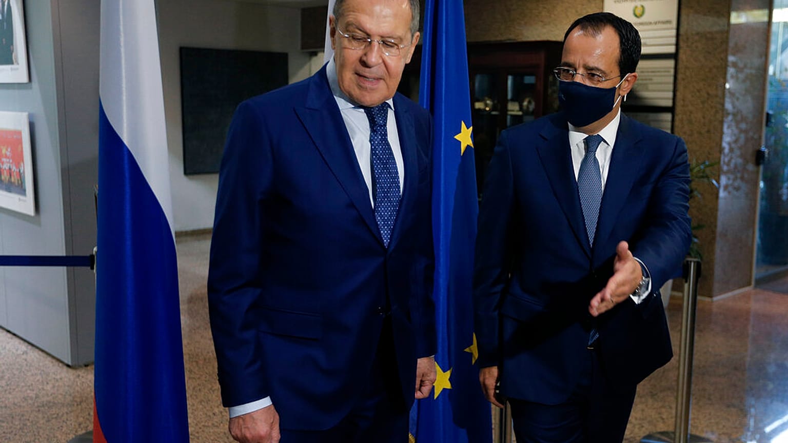 Russian Foreign Minister Sergey Lavrov, left, is greeted by his Cypriot counterpart Nikos Christodoulides