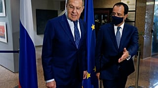 Russian Foreign Minister Sergey Lavrov, left, is greeted by his Cypriot counterpart Nikos Christodoulides