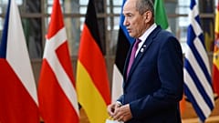 Slovenia's Prime Minister Janez Jansa speaks with the media as he arrived for an EU summit in Brussels in October.