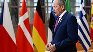 Slovenia's Prime Minister Janez Jansa speaks with the media as he arrived for an EU summit in Brussels in October.
