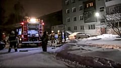 Firefighters work at the site of fire in the city of Yekaterinburg.