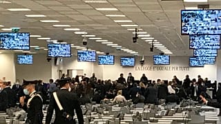 Carabinieri police officers stand inside a specially constructed bunker for the first hearing of a maxi-trial against more than 300 defendants of ‘ndrangheta.