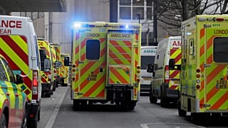 Ambulances queue outside the Royal London Hospital in London