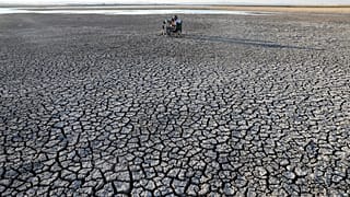 Cracked soil after a drought at Dikilitas Pond in the Golbasi district of Ankara in July 2020.