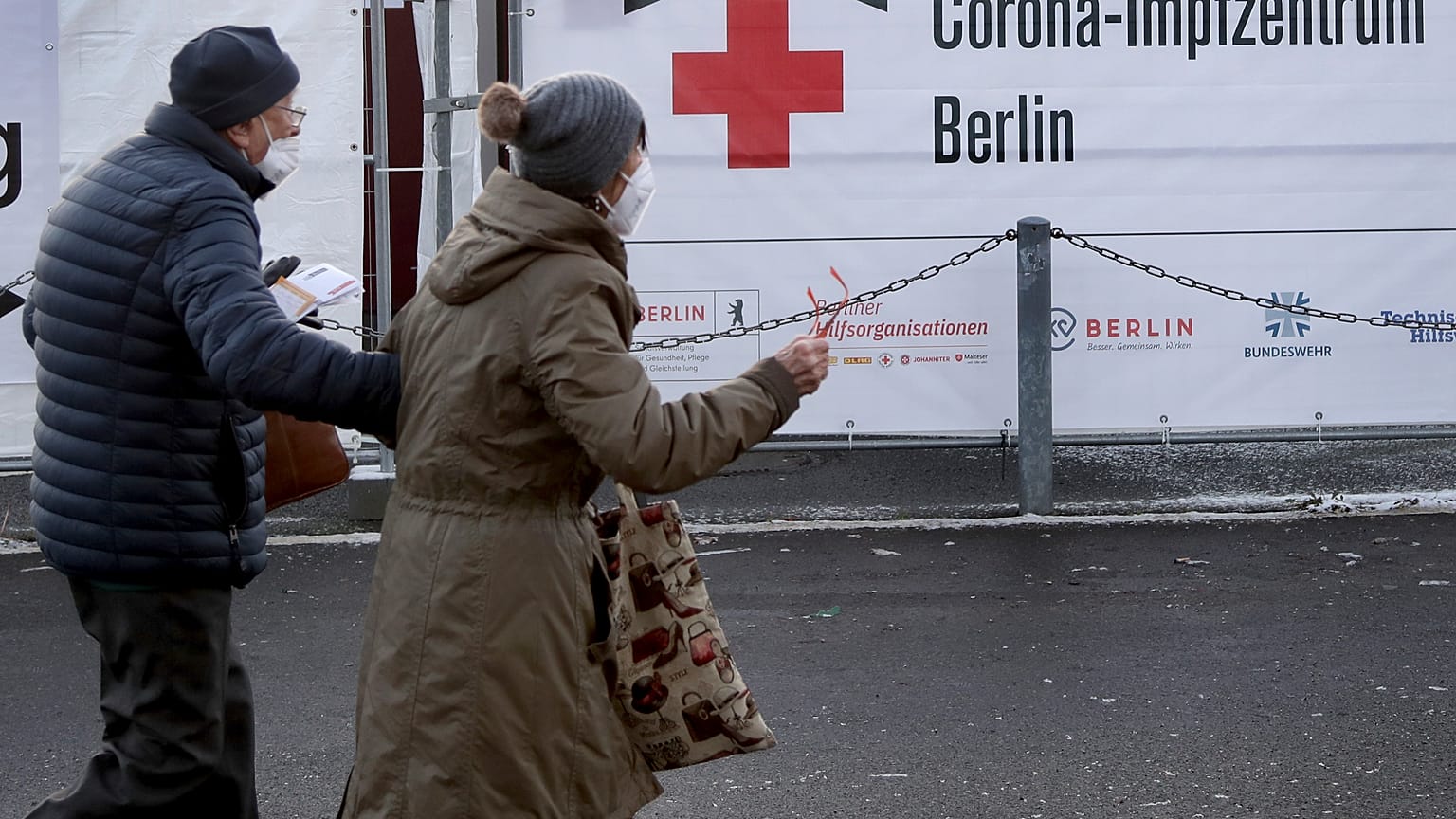 Two persons arrive at a new coronavirus, COVID-19, vaccination center in the 'Erika-Hess-Ice-Stadium' in Berlin