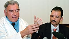 French Dr. Jean-Michel Dubernard, left, and France's Denis Chatelier hold a press conference at the Edouard Herriot hospital in Lyon, central France, Thursday, Jan.13, 2005