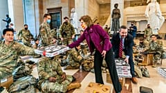 Pizzas are handed out to members of the National Guard gathered at the Capitol Visitor Center in Washington, USA, during the vote to impeach President Donald Trump. January 13