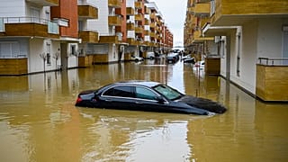 A car submerged on a flooded street in the town of Fushe Kosove after heavy rain and snow showers in Kosovo. January 11, 2021