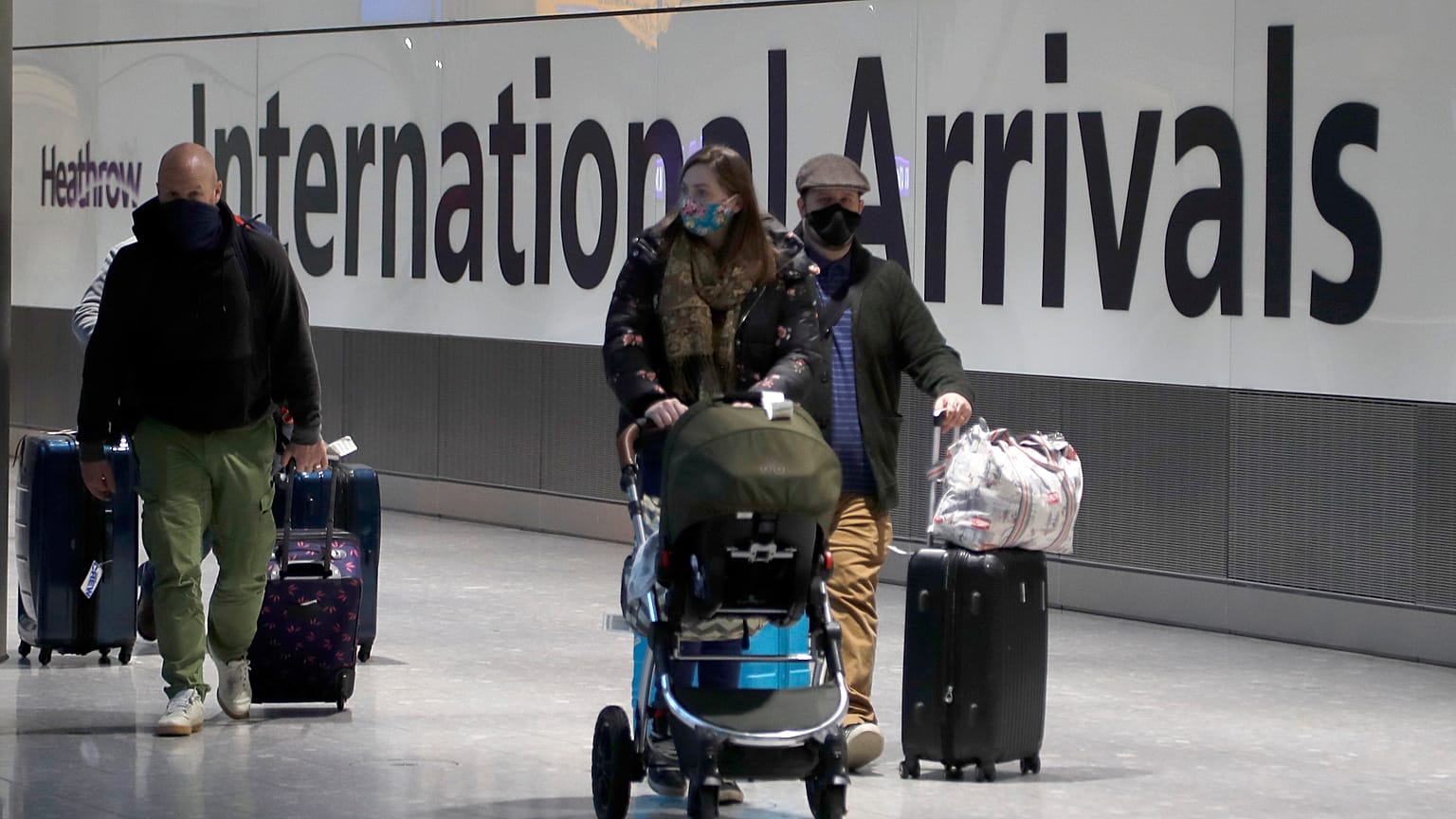 Travellers arrive at Heathrow Airport in London, Sunday, Jan. 17, 2021. Thousands of EU citizens were turned away from the UK border in the first quarter of 2021.