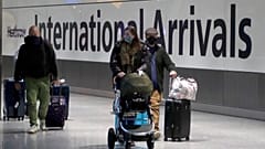 Travellers arrive at Heathrow Airport in London, Sunday, Jan. 17, 2021. Thousands of EU citizens were turned away from the UK border in the first quarter of 2021.