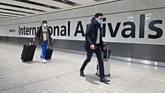 Passengers arrive at Heathrow airport the day before the UK government closes all travel corridors