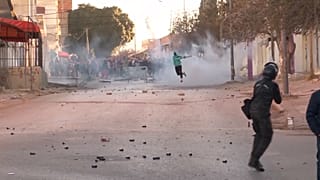 Police firing tear gas canisters, protesters throwing objects