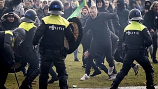 Police deployed water cannons against protestors in Amsterdam.