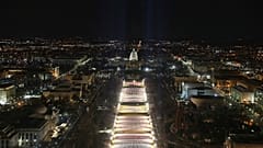 The U.S. Capitol building is seen as the "Field of Flags" are illuminated on the ground on the National Mall ahead of the inauguration ceremonies, Washington DC, Jan. 18, 2021