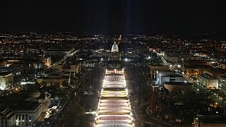 The U.S. Capitol building is seen as the "Field of Flags" are illuminated on the ground on the National Mall ahead of the inauguration ceremonies, Washington DC, Jan. 18, 2021