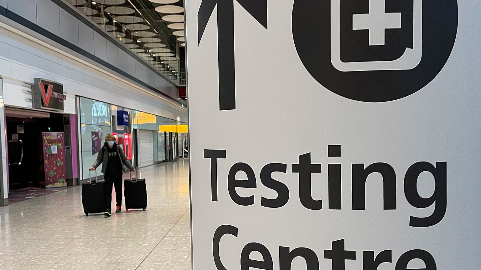 Travellers walk towards the Covid-19 testing centre at Heathrow Airport in London, Sunday, Jan. 17, 2021. 