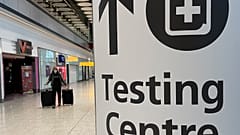 Travellers walk towards the Covid-19 testing centre at Heathrow Airport in London, Sunday, Jan. 17, 2021. 