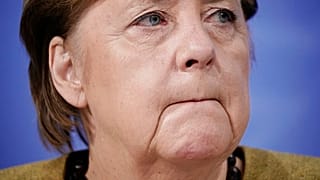 Angela Merkel takes part in a press conference following the consultations between the federal and state governments on further COVID measures
