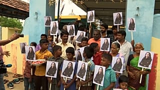 Villagers holding Kamala Harris's posters 