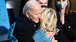 Joe Biden embraces his wife Jill after being sworn in as the 46th US President at the US Capitol in Washington, DC. January 20, 2021