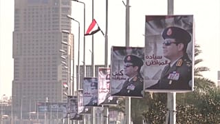 Портреты египетского президента в центре Каира