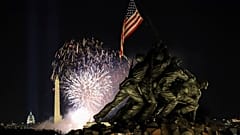 Fireworks to mark the Biden inauguration explode over the Washington Monument with the Marine Corps War Memorial in the foreground, Wednesday, Jan. 20, 2021, in Arlington, Va.
