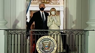 President Joe Biden and first lady Jill Biden watch fireworks from the White House, Wednesday, Jan. 20, 2021, in Washington. 