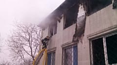 Pictures showed firefighters tackling smoke from burned-out rooms