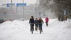 Cyclists in the snow in Oulu, Finland