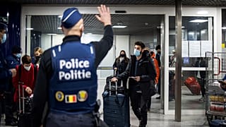 Belgian police officers control travellers of the Eurostar train earlier this month