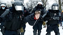 Police detain a man during a protest against the jailing of opposition leader Alexei Navalny in St. Petersburg, Russia. January 23, 2021