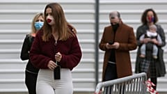 People queue to vote outside a polling station in Lisbon, Sunday, Jan. 24, 2021.