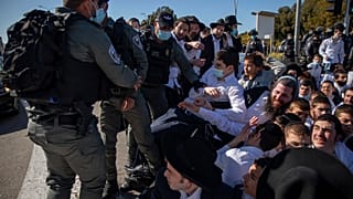 Israeli police officers clash with ultra-Orthodox Jews in Ashdod, Israel.