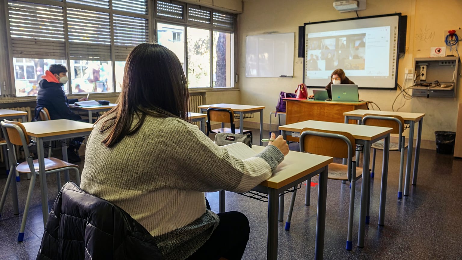 Students attend class at a high school in Rome, Monday, Jan. 18, 2021.