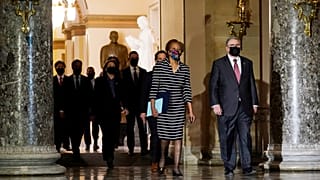 Clerk of the House Cheryl Johnson walk through Statuary Hall in the Capitol, to deliver to the Senate the article of impeachment against Donald Trump, 
